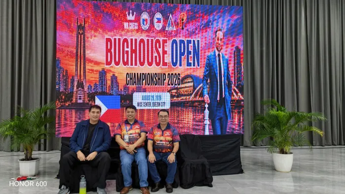 Officials seated in front of the Bughouse Open Championship 2026 backdrop