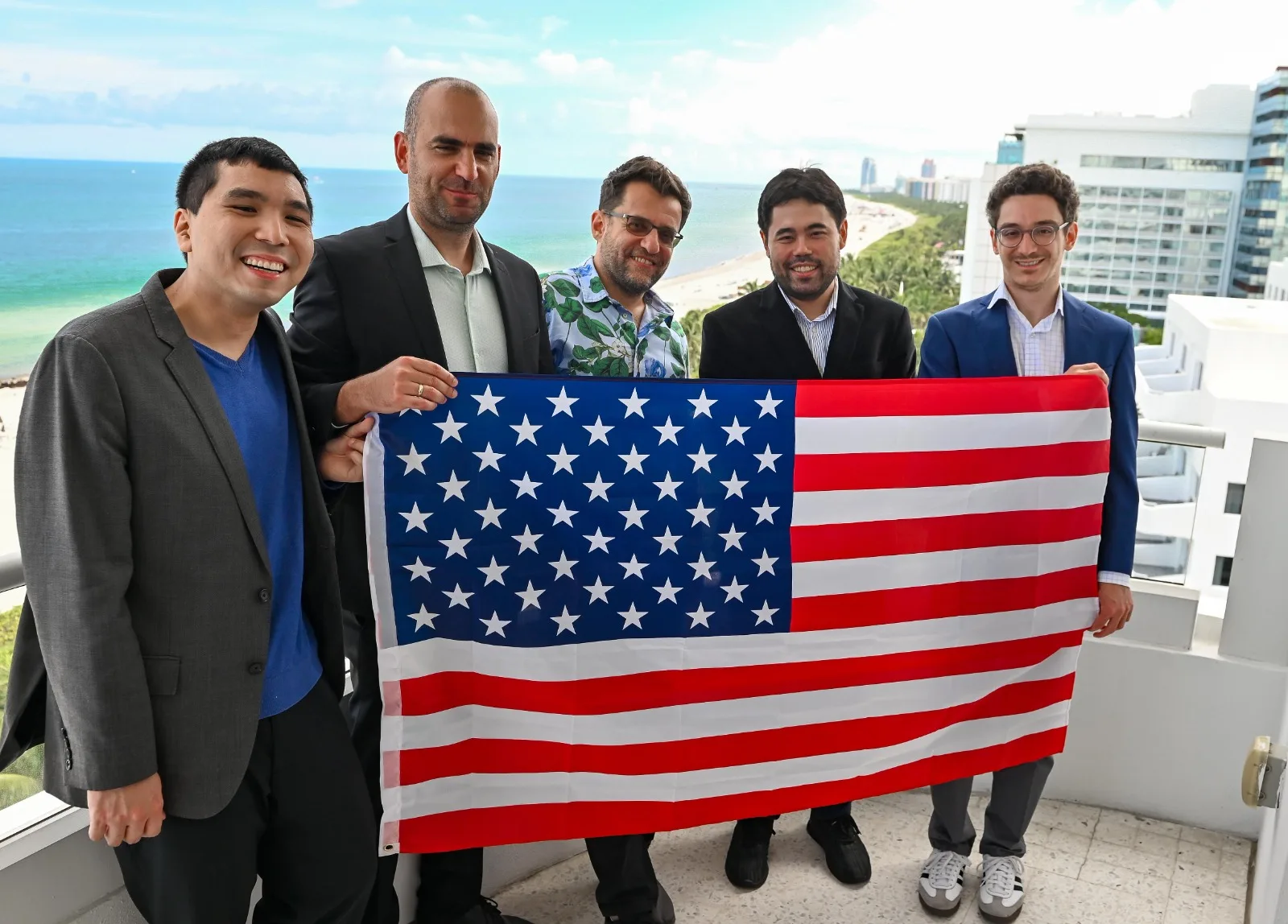 Team USA celebrates their 14–10 win over Uzbekistan on the balcony overlooking Miami Beach