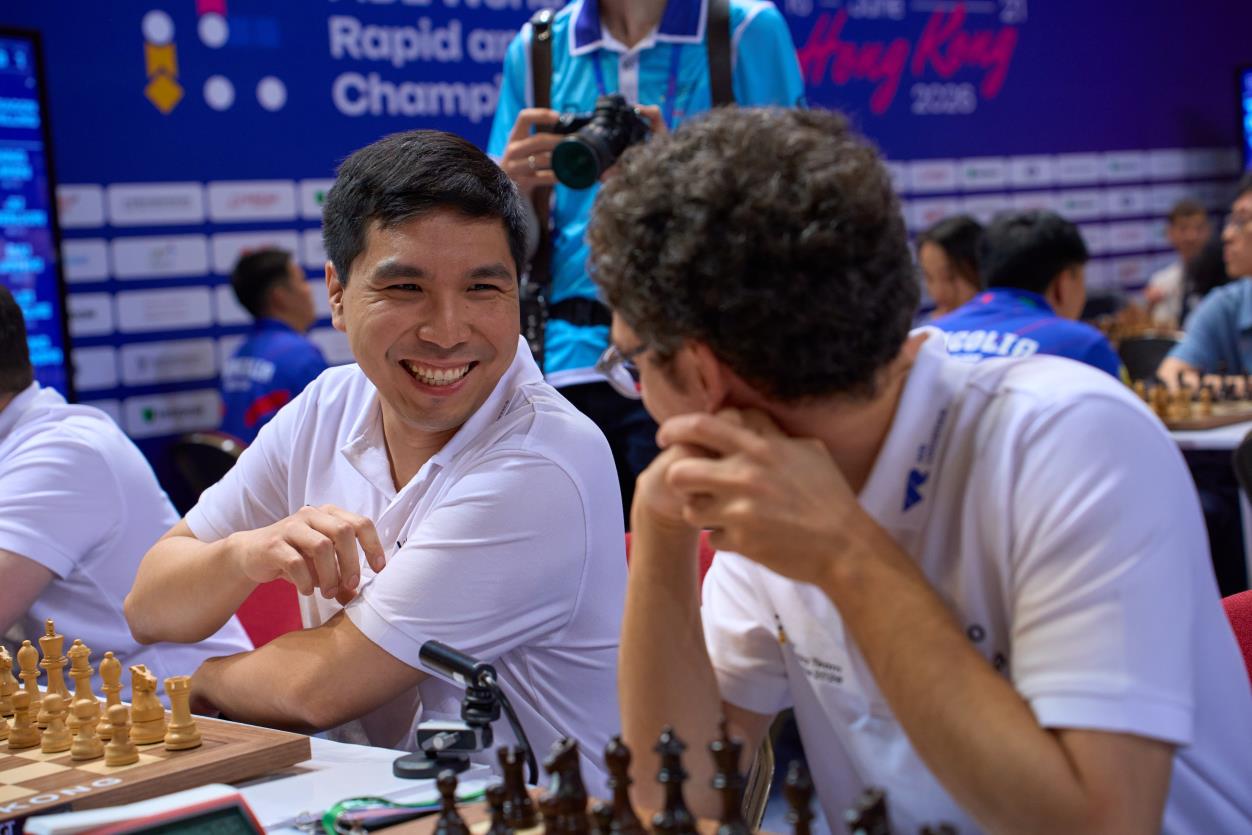 Wesley So shares a laugh with Fabiano Caruana before the start of a round in Hong Kong